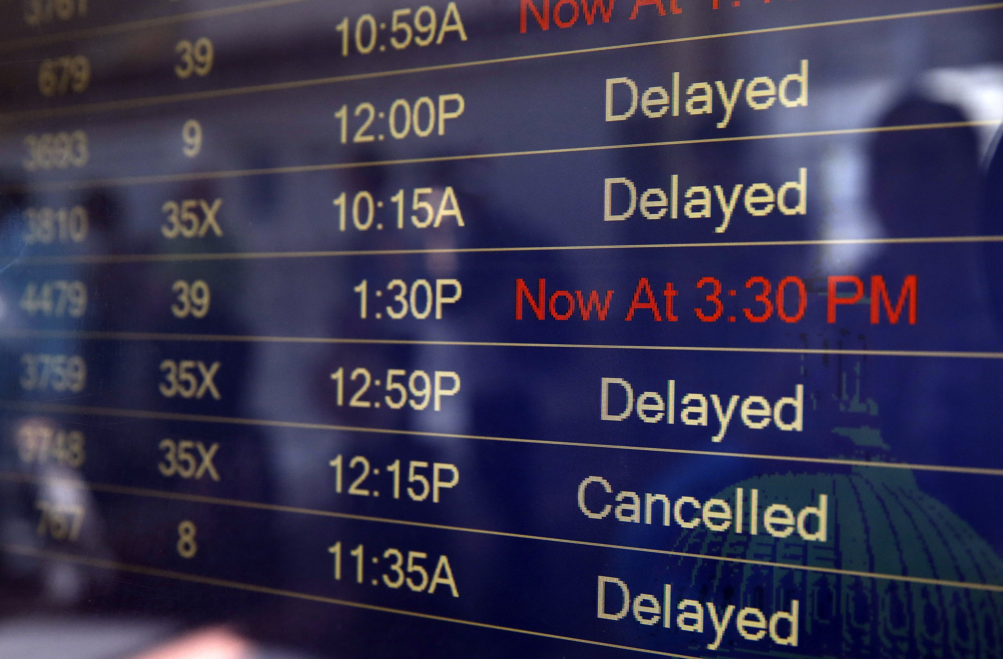 airport board with delays and cancellations