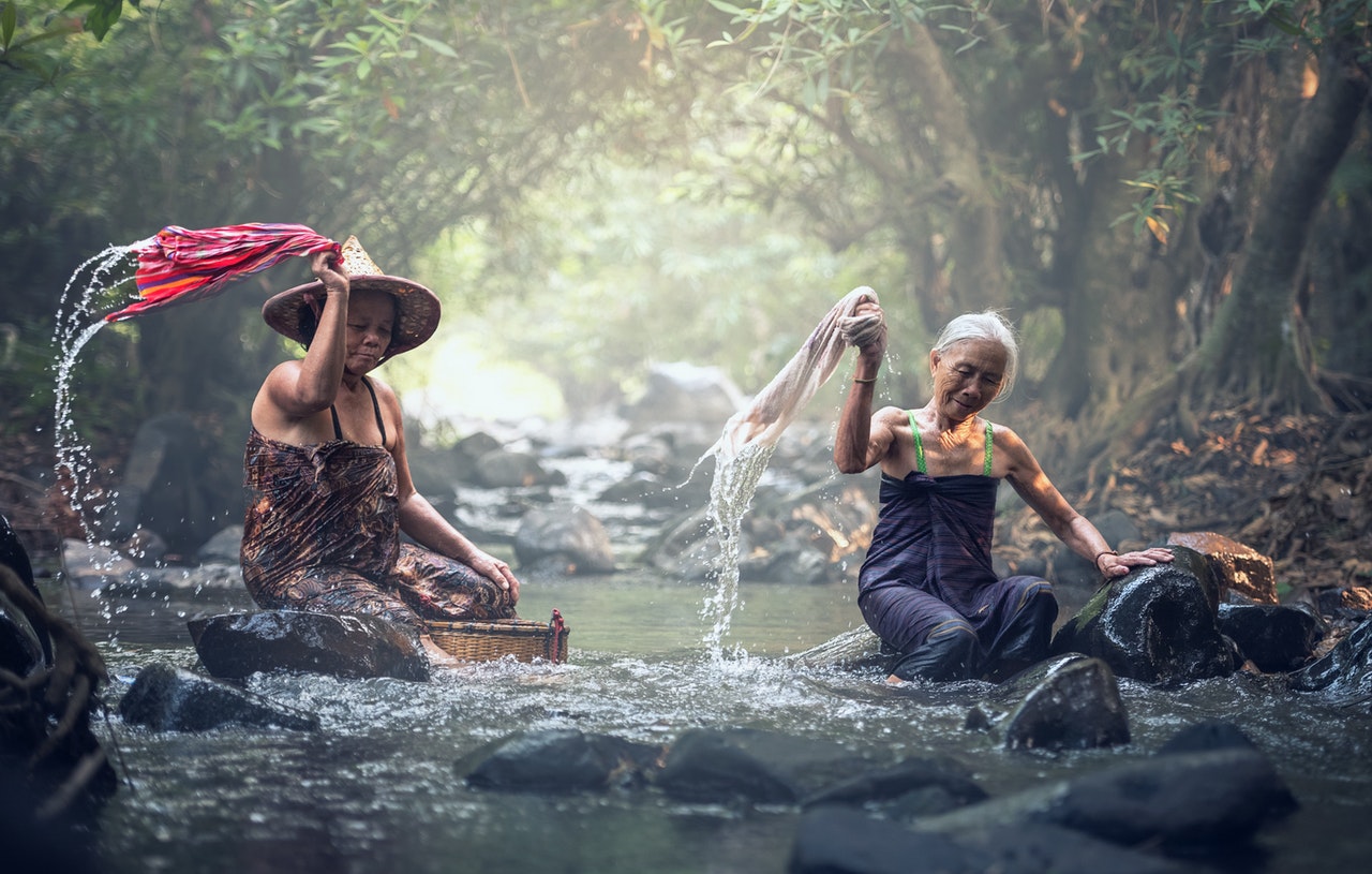 Asian women washing clothes in the river
